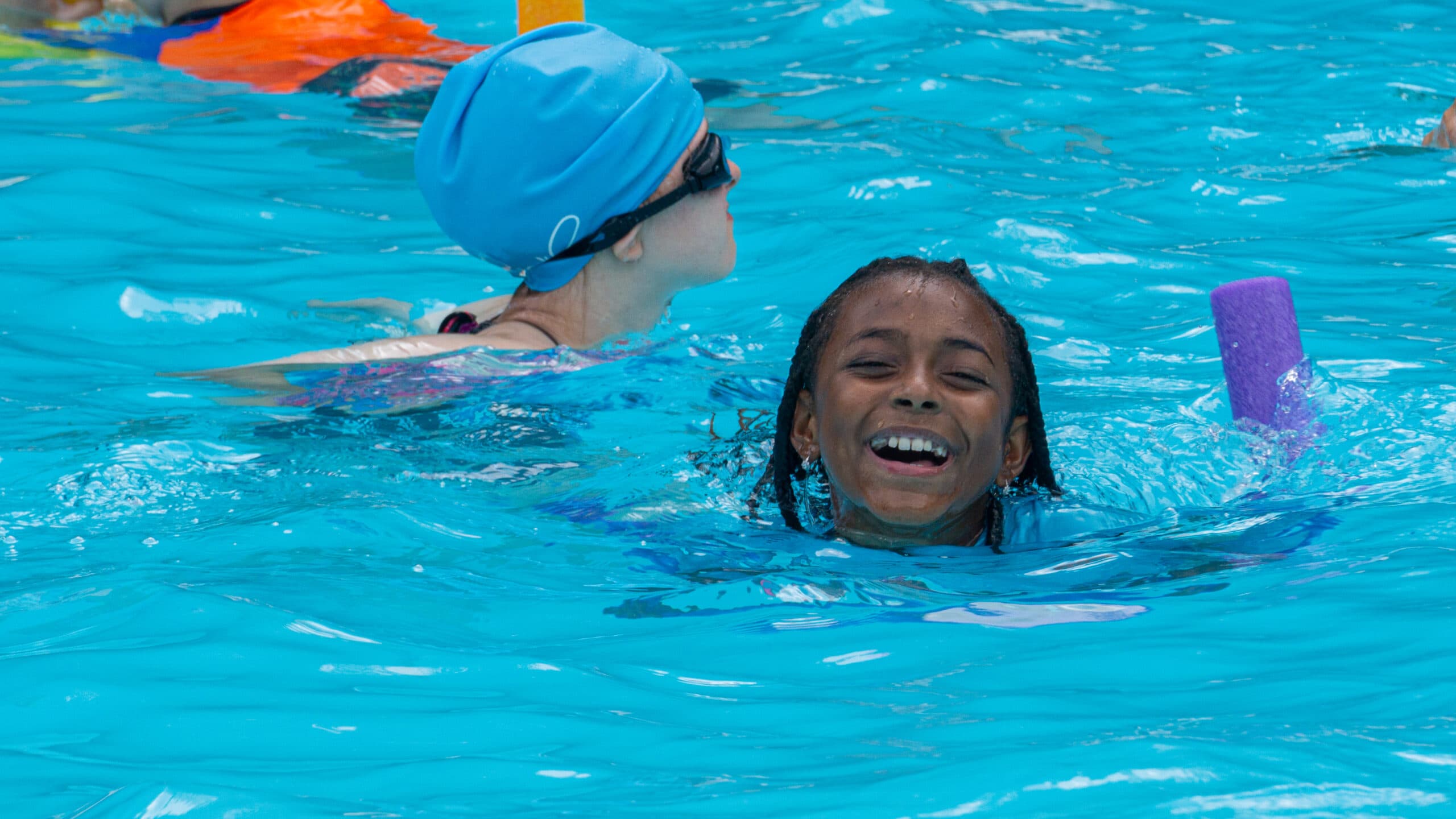 kids smiling in pool