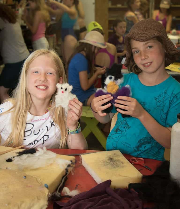 Handmade stuffed animal crafting at Eden Village Camp, a renowned summer camp promoting outdoor activities, sustainable living, and community building for children and teens.