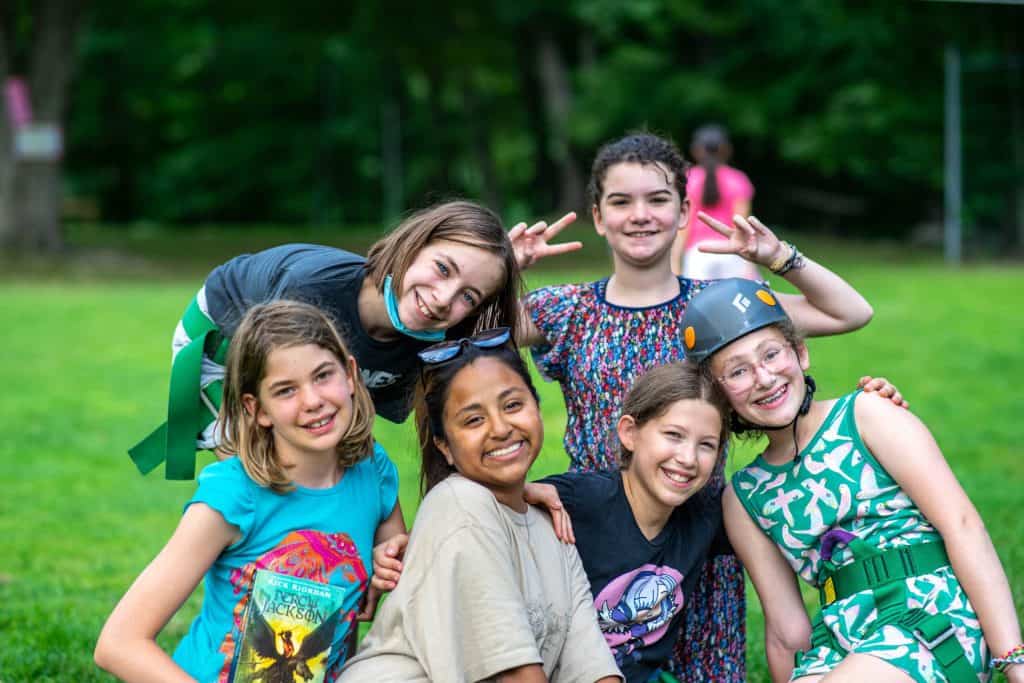 Adventure camp activities at Eden Village Camp with kids enjoying outdoor fun and team-building in a lush green environment.