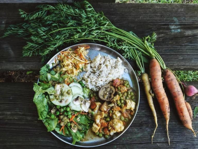 Fresh organic vegetables and grains served as part of Eden Village Camp's farm-to-table meals, promoting sustainability and healthy eating during summer camp activities.