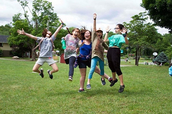 kids jumping at camp