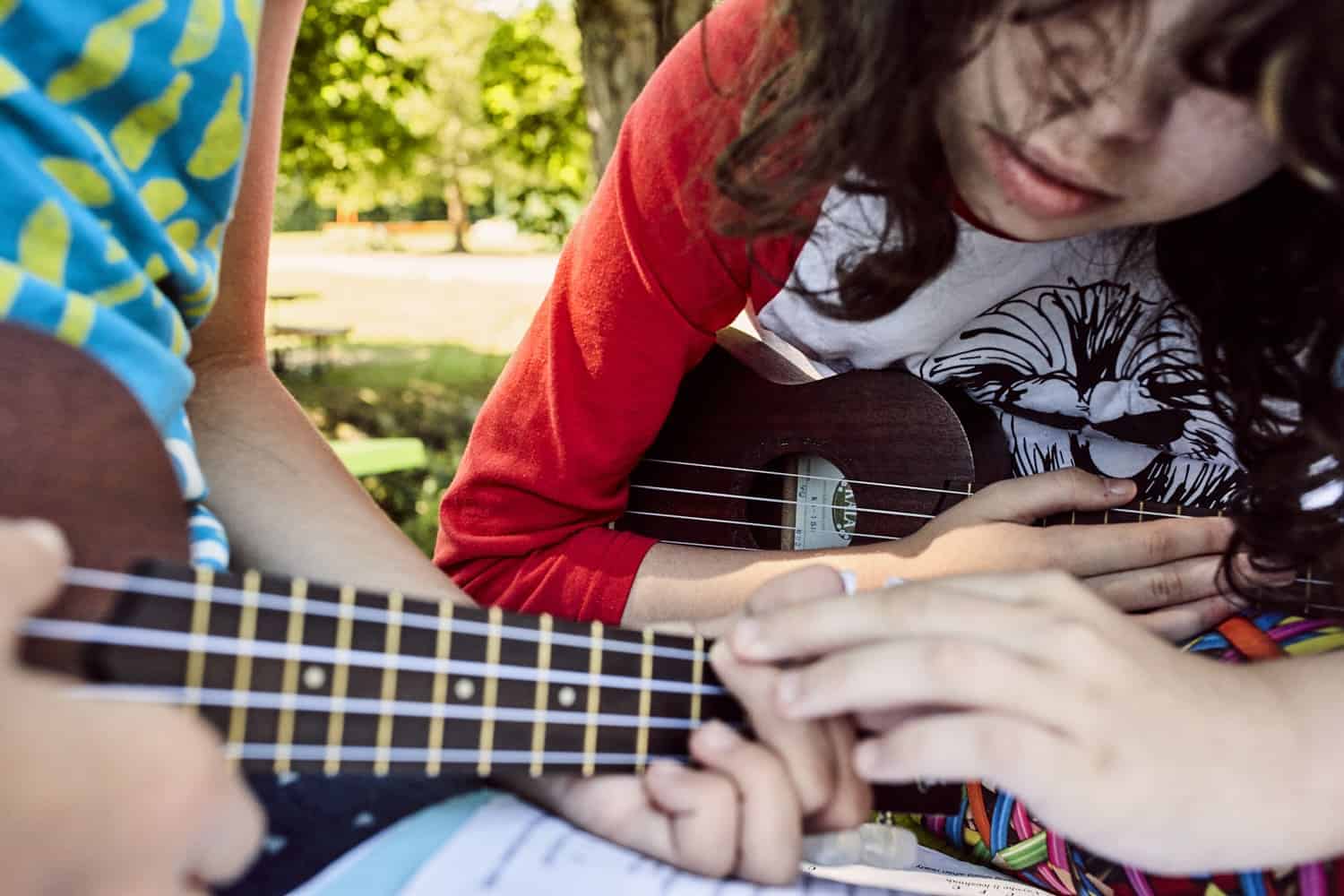 campers playing guitar